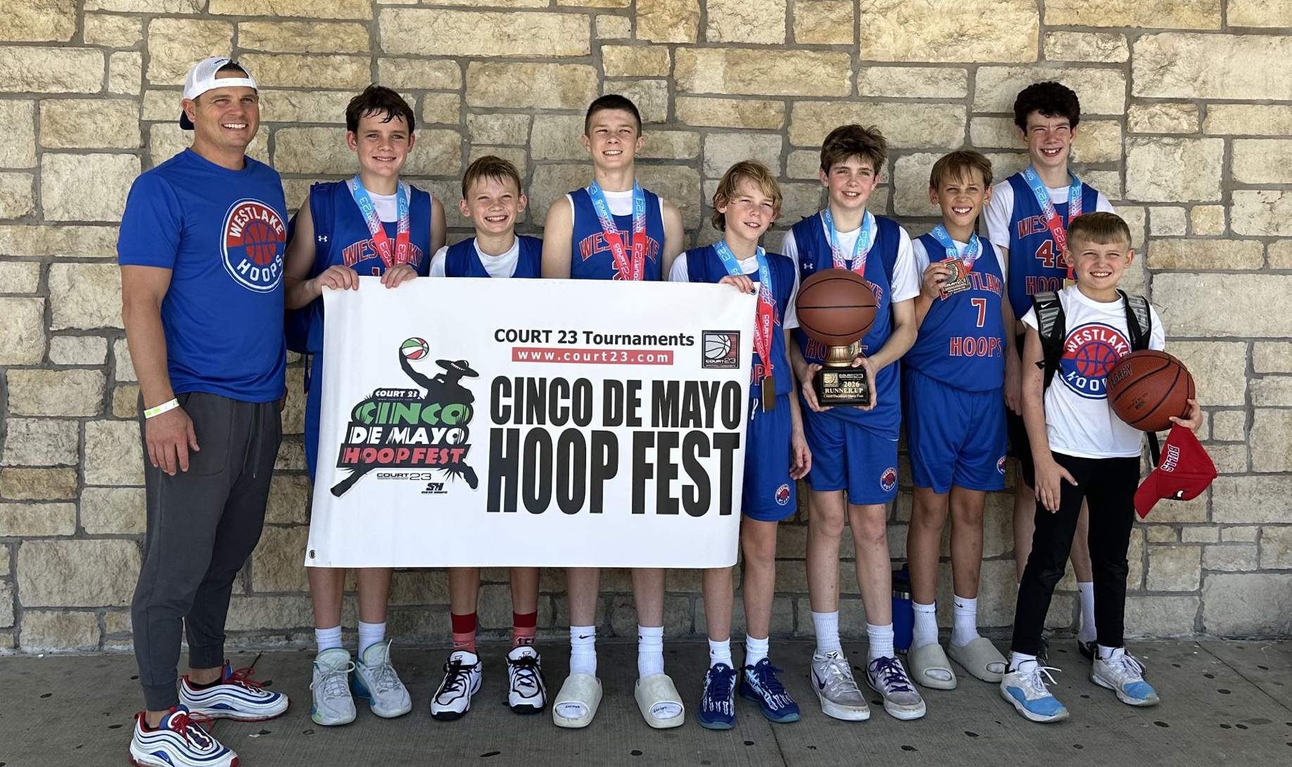 Westlake Hoops Select team with medals and trophy at the Court 23 Cinco de Mayo Hoop Fest.