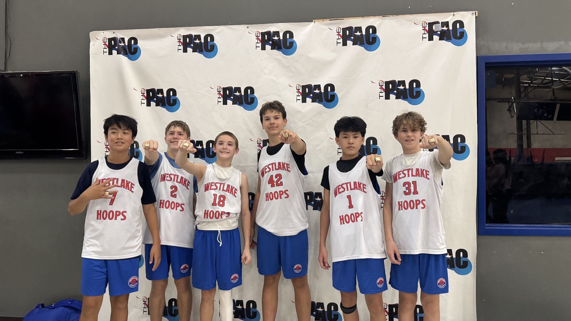 Westlake Hoops Select team showing off championship rings at The PAC.